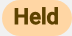 Held badge