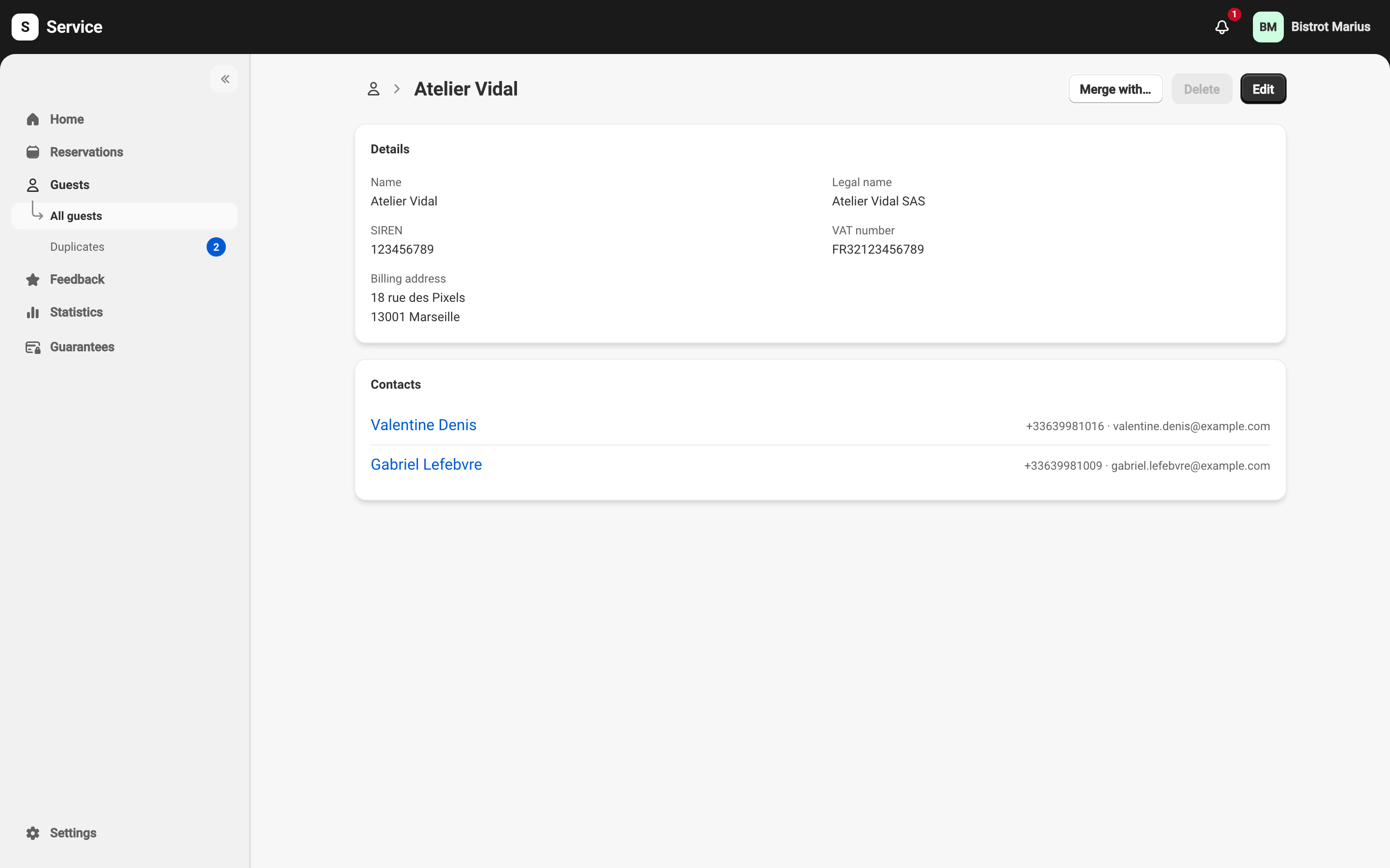 The Atelier Vidal company record: the Details card with the name, legal name, SIREN, VAT number and billing address, then the Contacts card listing Valentine Denis and Gabriel Lefebvre with their phone and email. Above them, Merge with…, a greyed-out Delete, and Edit.